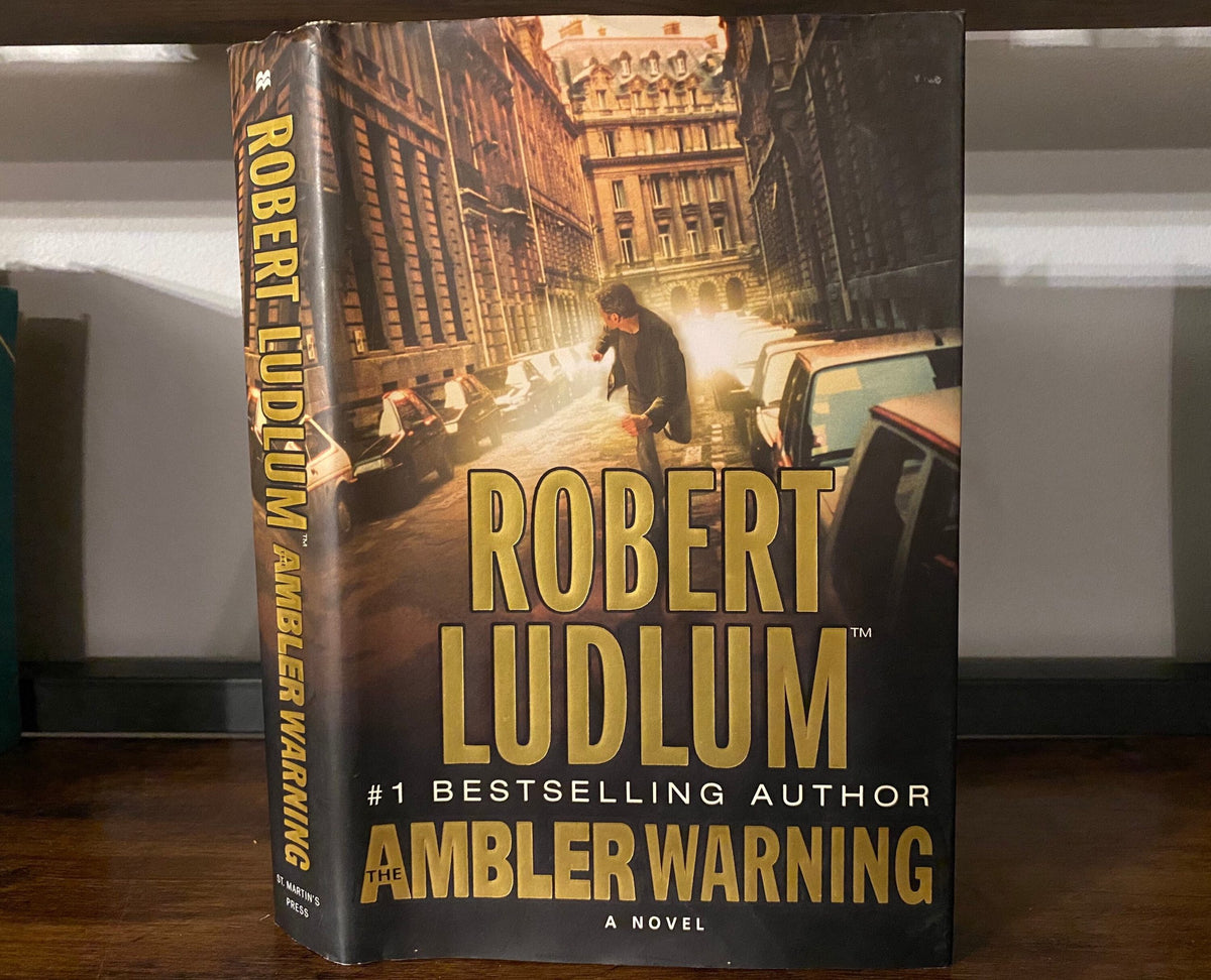 Robert Ludlum's first editions The Bourne Objective, The Ambler Warning, The Bourne Supremacy
